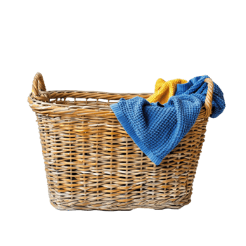Wicker basket with blue and yellow towels on transparent png