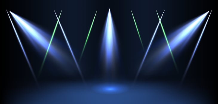 Three lights on a stage with a blue background vector