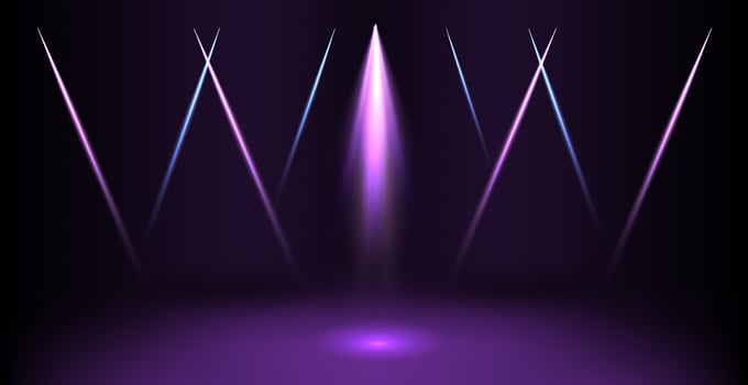 A purple stage with lights and a spotlight vector
