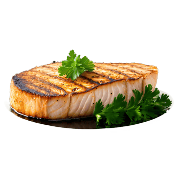 Pan fried swordfish steak golden brown crust garnished with parsley photographed from the side png