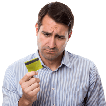 Man Frowning While Examining His Yellow Credit Card With Skepticism png
