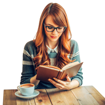 Young Woman Reading a Book at a Wooden Table With a Cup of Coffee png