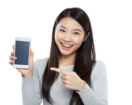 Happy woman pointing at a smartphone with a blank screen, wearing a light grey top png