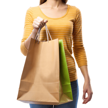 A woman dressed casually in jeans and a striped top holds several shopping bags, standing against a transparent background png