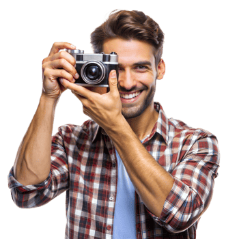 A man in a plaid shirt smiles while holding a vintage camera png