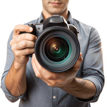 A man is holding a camera with a large lens png
