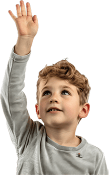 Young boy raising hand in classroom. png