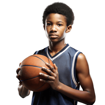 Confident young boy holding a basketball on a transparent background png