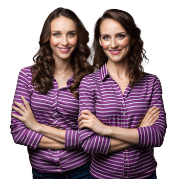 Smiling identical twins in matching striped shirts on transparent background png