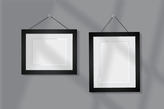 Realistic hanging photo frames gray background vector