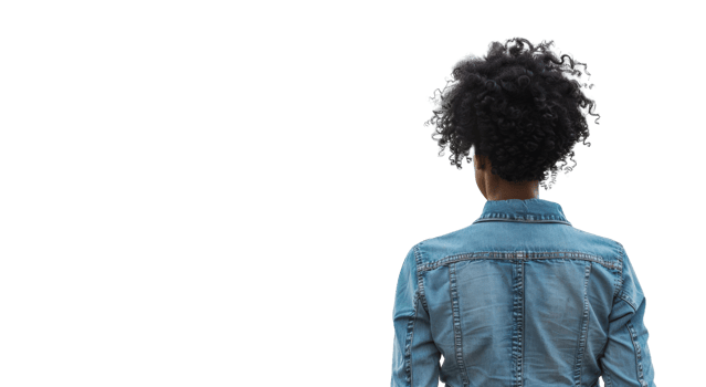 Woman with curly hair walks away in denim jacket, cut out - stock png. png