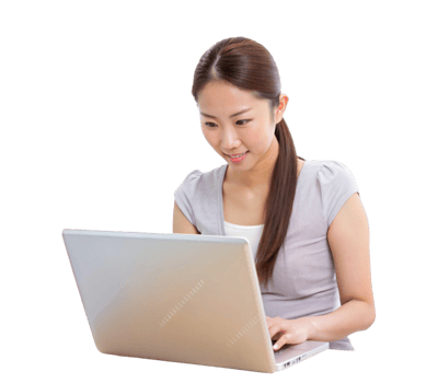 Smiling asian woman in traditional dress working on laptop at desk png