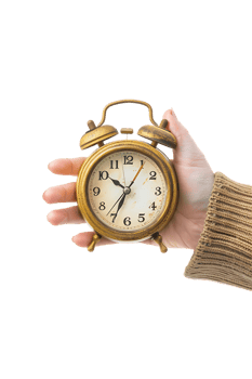 Hand holding alarm clock, isolated against transparent background png