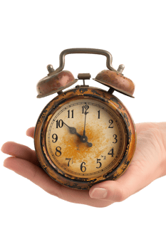 Hand holding alarm clock, isolated against transparent background png