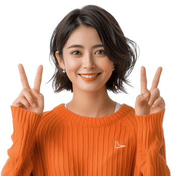 A woman in an orange sweater is smiling and holding up her hands in a peace sign. Concept of happiness and positivity png