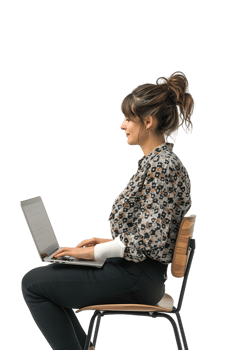 woman sitting on a chair and using a laptop, isolated against a transparent background png