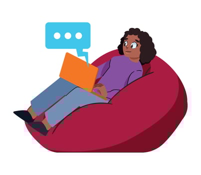 A woman sitting on a bean bag chair with a laptop vector