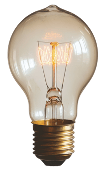 Vintage light bulb glowing warmly in a room, cut out - stock . png