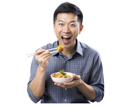 Young adult asian man is holding a bowl and eating with chopsticks- png