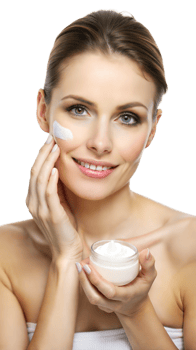 Blonde woman smiling while holding a skincare cream jar, promoting beauty care png