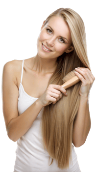 Young woman smiling and brushing her long, straight blonde hair png