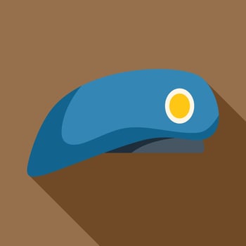 Blue military beret with yellow cockade lying on brown background vector