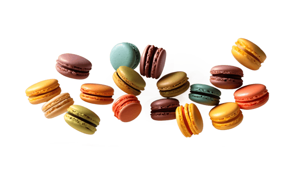 Various colorful of macarons floating on the air isolated on clean transparent background png