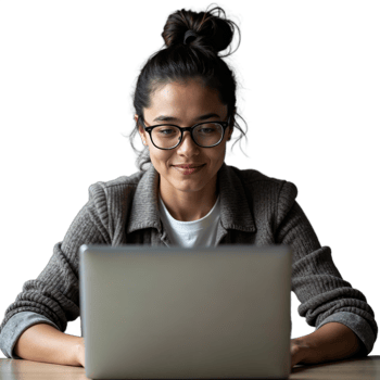 A woman wearing glasses smiles while looking at her laptop, likely working from home png