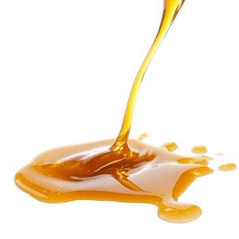 Golden honey flowing from a spoon onto a surface isolated transparent background png