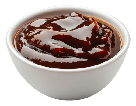 Thick homemade barbecue sauce in a white bowl png