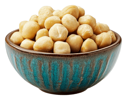 Macadamia nuts in a decorative bowl on a table png