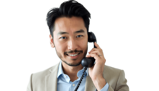 Man in a white shirt smiling and talking on the phone, casual portrait on a black background. png