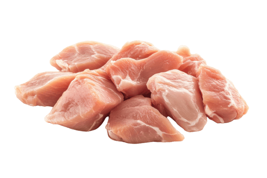 Fresh raw pork chunks on a white surface ready for preparation and cooking in a kitchen png