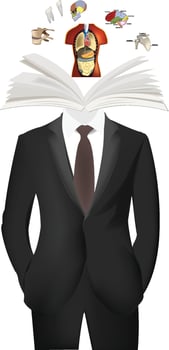 Doctor studying human anatomy with open book and body parts floating vector