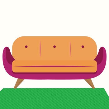 A couch sitting on a green rug vector