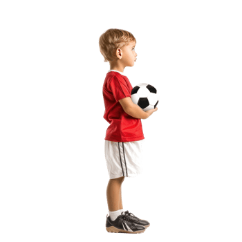 Little boy in football clothes standing with ball under arm side view isolate on transparency background png