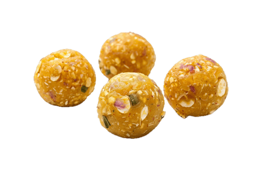 Close-up of peanut sesame ladoos dessert. png