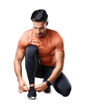 A man in an orange shirt is tying his shoes png