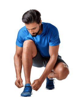 A man in blue shirt tying his shoes png