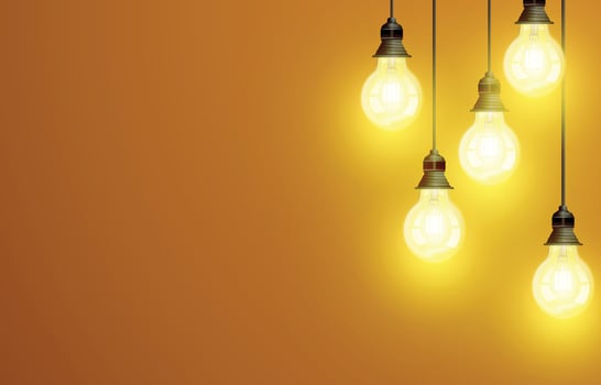 Realistic light bulbs on a yellow background with copy space vector