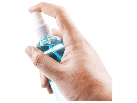 A hand holding a bottle of hand sanitizer png