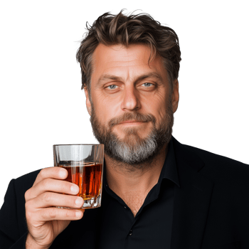 Mature man enjoying a glass of whiskey with a confident smile png