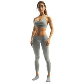 A woman in stylish yoga pants and sports bra poses confidently in a minimalistic studio setting, yoga pants png
