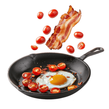 floated Fried egg, bacon and cherry tomatoes flying into iron skillet isolate on transparency background png