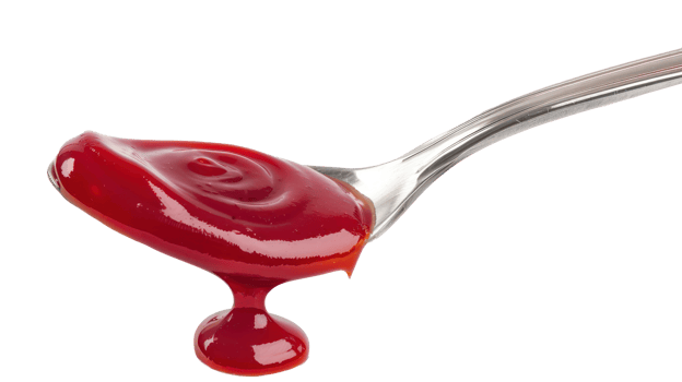 Drip of ketchup in a spoon isolate on transparency background png