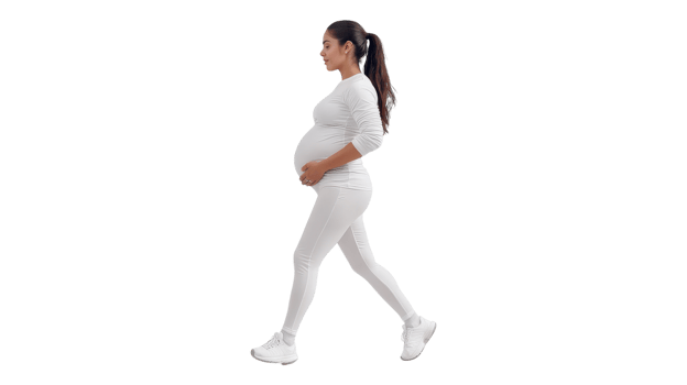 A pregnant woman walking in white leggings png