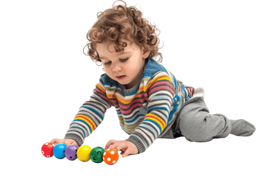 A baby is playing with a bunch of colorful balls. The baby is sitting on the floor and is reaching for the balls. The scene is playful and fun, and it shows the baby's curiosity png