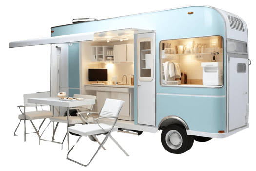 A blue and white trailer with a table and chairs outside. The trailer has a kitchen and a bathroom png