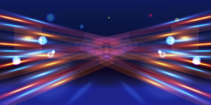 Abstract colorful light streaks with bokeh effects on a dark blue gradient background vector