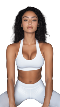 Confident woman in white sports bra and leggings sitting on transparent background, fit and relaxed png